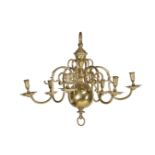 A Dutch or English cast and turned brass six light chandelier
