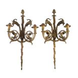 A pair of gilt bronze twin light wall appliques after designs by Pierre Gouthière (French