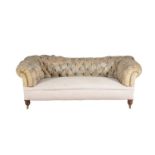 A Victorian walnut and upholstered sofa