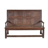 An oak settle in early 18th century style