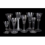 Five various plain-stemmed wine glasses