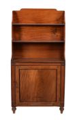 A Regency mahogany waterfall cupboard bookcase