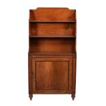 A Regency mahogany waterfall cupboard bookcase