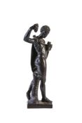 A Continental, probably Italian, carved and ebonised wood model of a youthful Bacchus,