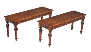 A pair of oak hall benches in Victorian style