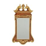 A burr walnut and parcel gilt wall mirror