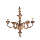 An Italian carved, polychrome painted and giltwood and wrought iron six light pricket chandelier, pr