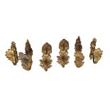 Three pairs of French gilt bronze curtain tie backs in Rococo taste