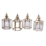 A set of four gilt metal and glazed hexagonal hall lanterns