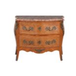 A Belgian walnut and gilt metal mounted commode in Louis XV style