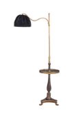 A Chinoiserie black lacquered and brass standard reading lamp