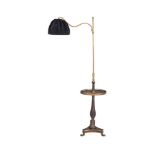 A Chinoiserie black lacquered and brass standard reading lamp