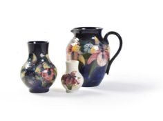 Orchid, three Moorcroft Pottery items
