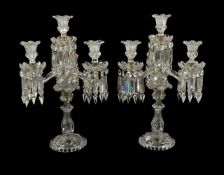 Baccarat, a pair of four light cut and moulded glass candelabra