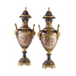 A pair of Limoges pottery Sevres-style blue-ground and gilt-metal-mounted vases and covers