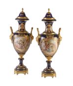 A pair of Limoges pottery Sevres-style blue-ground and gilt-metal-mounted vases and covers