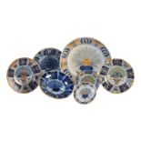 A selection of seven various polychrome and blue and white Dutch Delft 'Peacock' pattern plates