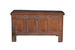 A carved oak coffer