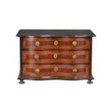 A South German walnut and ebonised cabinet maker’s model of a serpentine chest of drawers