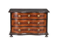 A South German walnut and ebonised cabinet maker’s model of a serpentine chest of drawers