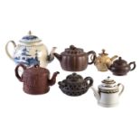 A selection of English and Chinese ceramic teapots and covers