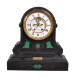 A black marble and malachite inset mantel clock