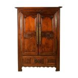 A French carved oak press cupboard