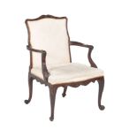 A carved mahogany armchair in George III style