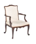 A carved mahogany armchair in George III style