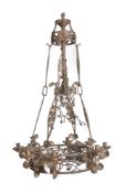 A Continental, possibly French, wrought iron eight light chandelier loosely in Gothic taste