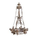 A Continental, possibly French, wrought iron eight light chandelier loosely in Gothic taste