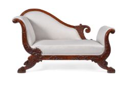 A Continental carved mahogany and upholstered day bed