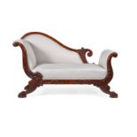 A Continental carved mahogany and upholstered day bed