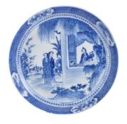 An Arita Porcelain Saucer Dish of typical circular form decorated in underglaze-blue with a scene of