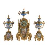 A French gilt spelter and Sevres style porcelain inset clock garniture