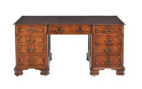 A mahogany twin pedestal desk in George III style