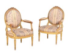 A suite of giltwood and upholstered seat furniture in Louis XVI style