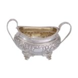 A George IV silver twin handled oval sugar basin