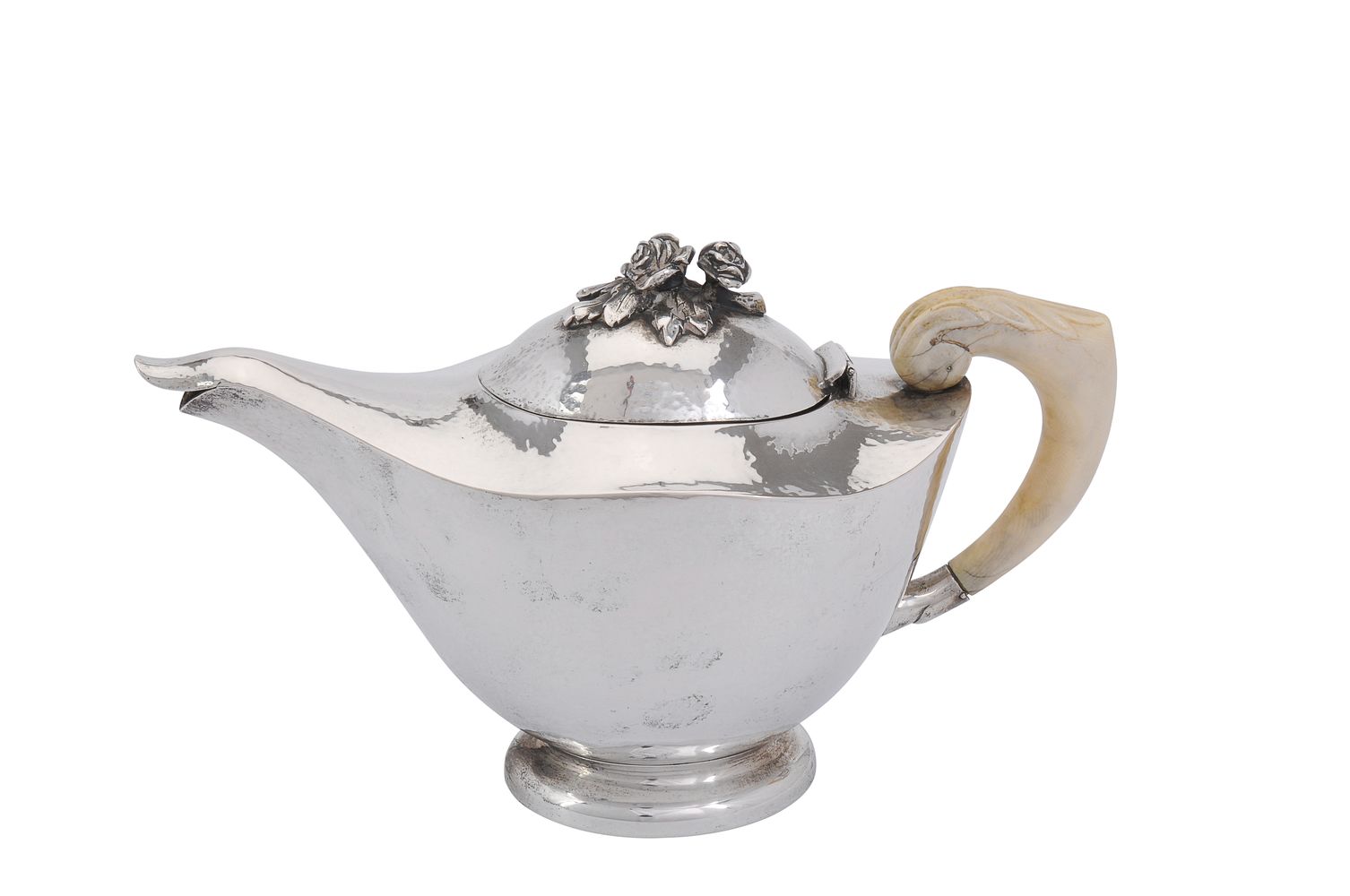 ϒ An Italian hammered silver oval tea pot by Luigi Genazzi