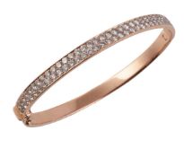 A gold coloured diamond two row bangle