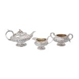 ϒ A matched George IV silver lobed circular pedestal three piece tea service