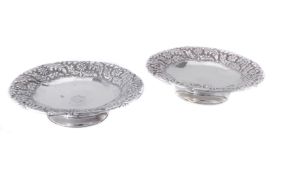 A pair of late Victorian silver shaped circular pedestal dishes by Horace Woodward & Co.