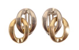 A pair of gold coloured ear clips by Carlo Weingrill