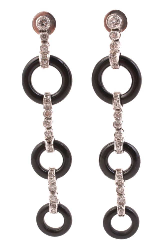 A pair of onyx and diamond earrings