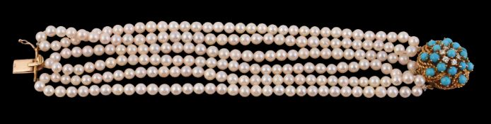 A cultured pearl bracelet with a turquoise and diamond clasp