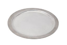 A silver circular salver by Christopher Lawrence