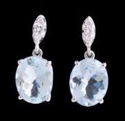 A pair of aquamarine and diamond earrings