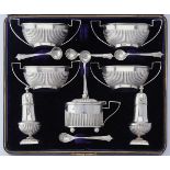 A late Victorian silver seven piece cruet set by Faraday & Davey