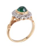 An emerald and diamond ring