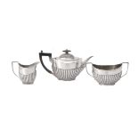 A late Victorian silver oval tea service by The Goldsmiths & Silversmiths Co. Ltd